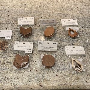 Set of seven packages of wood components for crafts